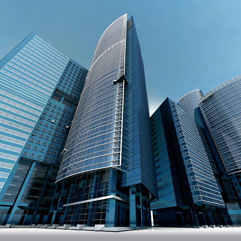 Futuristic urban skyscrapers with glass facades reflecting a vibrant blue sky.